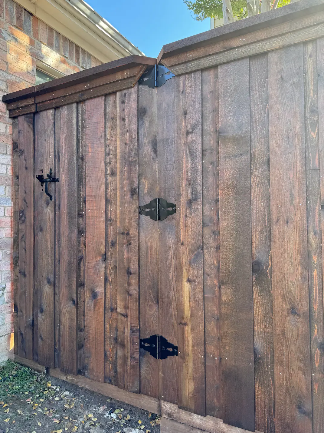 Custom wood driveway gate with automatic opener in Dallas
